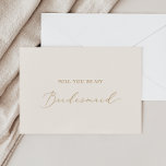 Delikate Gold und Cream Bridesmaid Vorschlagkarte Einladung<br><div class="desc">Diese zarte Gold- und Cremetrante-Vorschlagskarte ist perfekt für eine moderne Hochzeit. Das romantische minimalistische Design besticht durch eine hübsche und elegante Champagner-goldgelbe Typografie auf Elfenbein-Creme-Hintergrund mit einem klaren und schlichten Look. Passen Sie die Karte mit dem Namen der Braut und der Brautjungfrau an. Personalisieren Sie die Rückseite der Karte mit...</div>