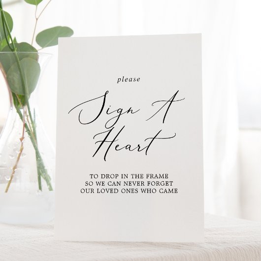 Delikate schwarze Kalligrafie Zeichen für ein Herz Sockelschild