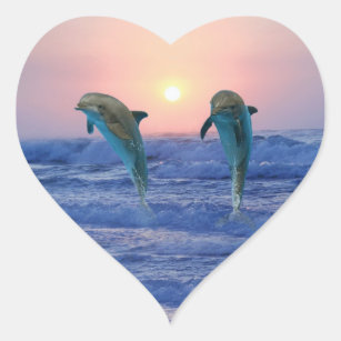 Delphine bei Sonnenaufgang Herz-Aufkleber