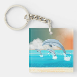 Delphine, die im Ozean brechen Schlüsselanhänger