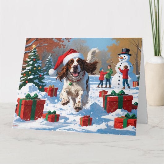 Der englische Setter läuft im Schnee mit Weihnacht Karte (Vorderseite)