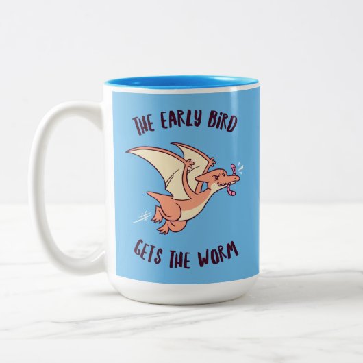 Der frühe Vogel bekommt den Wurm Zweifarbige Tasse (Links)