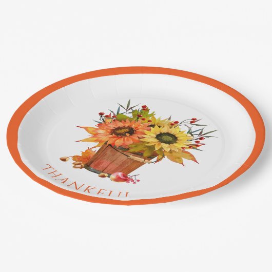 Der Herbst lässt Sonnenblumen in der Holzbügel dan Pappteller (Schrägansicht)