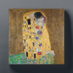 Der Kuss von Gustav Klimt Fotoplatte<br><div class="desc">Der Kuss von Gustav Klimt Der Kuss ist ein Ölgemälde mit Goldblatt, Silber und Platin vom österreichischen Symbolik-Maler Gustav Klimt. Es wurde irgendwann in den Jahren 1907 und 1908 gemalt, auf dem Höhepunkt dessen, was Gelehrte seine "Goldene Periode" nennen. Mit schimmernden Goldtönen, stilisierten Formen und sentimentaler Ikonographie verzaubert der Kiss...</div>