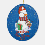 Der niedliche Schneemann des Babys in seiner moder Keramik Ornament (Links)