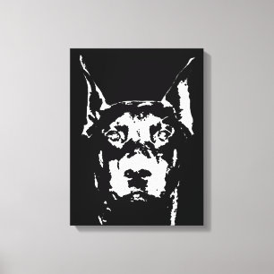 Der schwarze Dobermann u. das Weiß wickelten Leinwanddruck