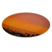 Der Sonnenuntergang über der Stadt Schneidebrett (Ecke)