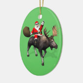 Der Weihnachtsmann fährt auf Elch Keramikornament (Links)