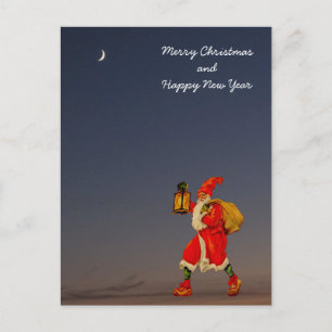 Der Weihnachtsmann im Dunkeln mit einer Laterne Feiertagspostkarte