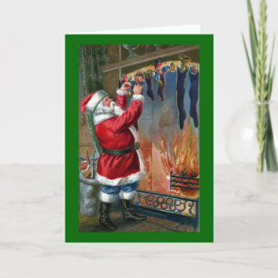 Der Weihnachtsmann ist beschäftigt, Strümpfe zu fü Feiertagskarte