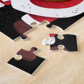 Der Weihnachtsmann mit einem Geschenkpuzzle. Puzzle (Seite)
