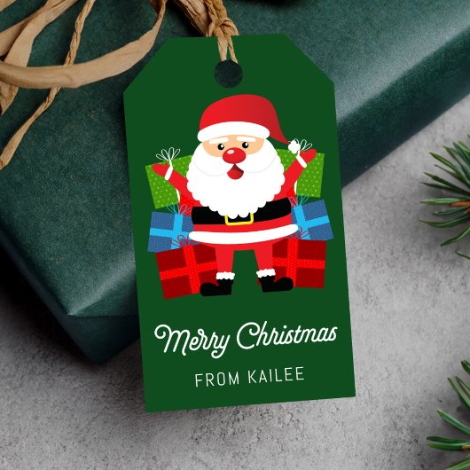 Der Weihnachtsmann präsentiert einen grünen Weihna Geschenkanhänger