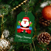 Der Weihnachtsmann präsentiert einen grünen Weihna Geschenkanhänger