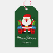 Der Weihnachtsmann präsentiert einen grünen Weihna Geschenkanhänger (Vorderseite)