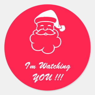 Der Weihnachtsmann sieht dir beim Aufkleber zu