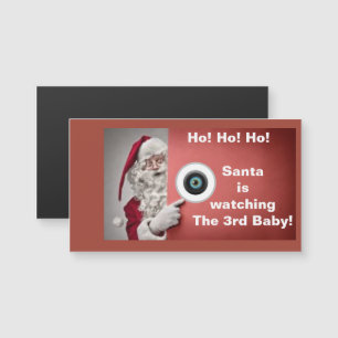 Der Weihnachtsmann sieht sich den dritten Babymagn Magnetkarte