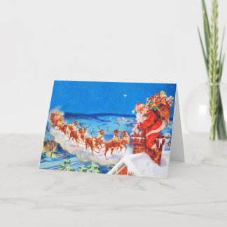 Der Weihnachtsmann und sein Rentier auf dem Dach Feiertagskarte