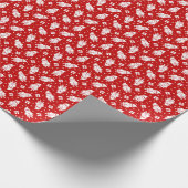 Der weiße Weihnachtsmann über den roten Hintergrun Geschenkpapier (Ecke)