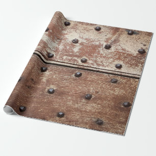 Detail einer alten, bemalten, schamlosen Tür mit r Geschenkpapier
