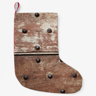 Detail einer alten, bemalten, schamlosen Tür mit r Kleiner Weihnachtsstrumpf