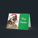 Deutscher Schäferhund mit einem Weihnachtshut Feiertagskarte<br><div class="desc">Ein Niedlicher deutscher Hirte,  der zu Weihnachten einen Weihnachtshut trägt</div>