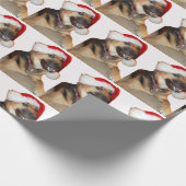 Deutscher Schäferhund mit einem Weihnachtshut Geschenkpapier (Ecke)