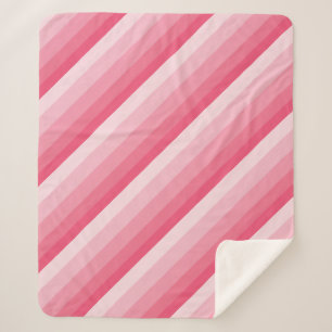 Diagonale Ombre-Streifen in rosa Tönen Sherpadecke