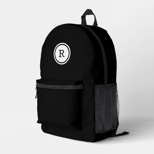 Dicke Monogramm im weißen Kreis auf schwarz Bedruckter Rucksack (Rückseitige Ecke Rechts)