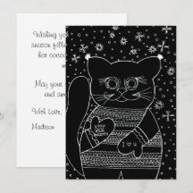 Dicke Winterkatze im schwarzen Weihnachtspullover