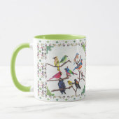 Die Ansammlungs-bunte Singvogel-gemusterte Tasse (Links)