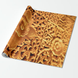 Die antike Goldblume nah Geschenkpapier