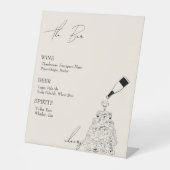 Die Bar mit dem Champagnerturm Sockelschild (Vorderseite)