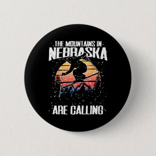 Die Berge in Nebraska fordern sonniges Skifahren Button