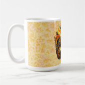 Die gelbe Federmaske im Blumenmuster Kaffeetasse (Links)