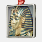 Die Goldbegräbnismaske, vom Grab von Tutankhamun Silbernes Ornament (Links)