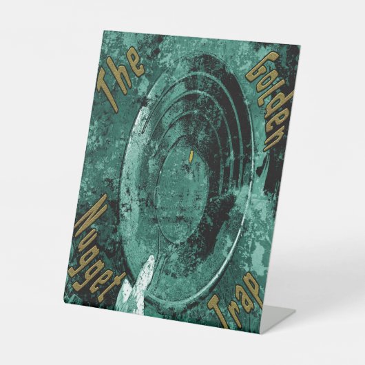 Die goldene Nugget-Falle Sockelschild (Vorderseite)