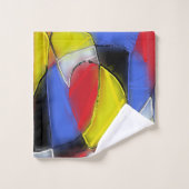 Die Handtücher sind rot, gelb, schwarz und blau. (Waschlappen)