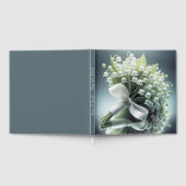 Die Hochzeitslilie des Tales Bouquet auf einem Spi Gästebuch (Voll)