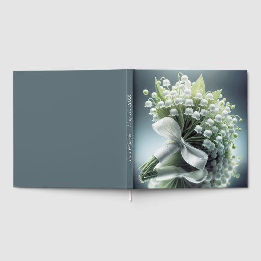 Die Hochzeitslilie des Tales Bouquet auf einem Spi Gästebuch (Voll)