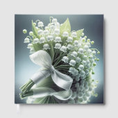 Die Hochzeitslilie des Tales Bouquet auf einem Spi Gästebuch (Vorderseite)