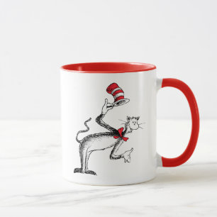 Die Katze im Hut verbeugt sich Tasse