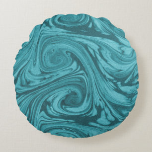 Die Kulisse ist in türkisfarbenen, runden Tönen ge Rundes Kissen