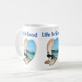 Die Lage in einer Muschel am Strand, Kaffeetasse (Vorderseite Links)