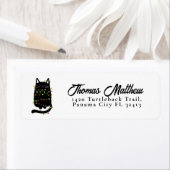 Die lustige schwarze Katze hat sich im Weihnachtsl (Insitu)