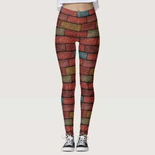 Die orangefarbenen, orangefarbenen Steinziegelfarb Leggings