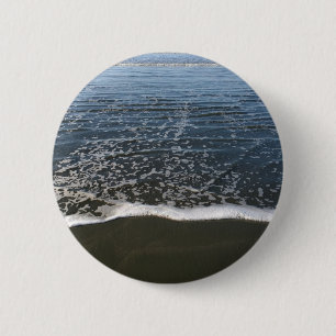 Die Ozeantide, die Ashore waschen Button