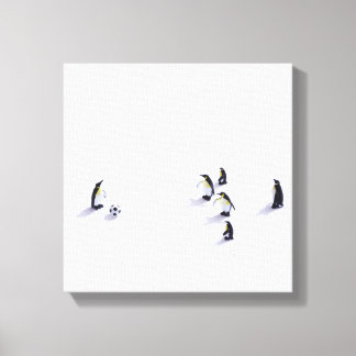 Die Pinguine beim Fußballspielen Leinwanddruck