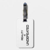 Die Realität ist unbesiegt Gepäckanhänger (Rückseite vertikal)