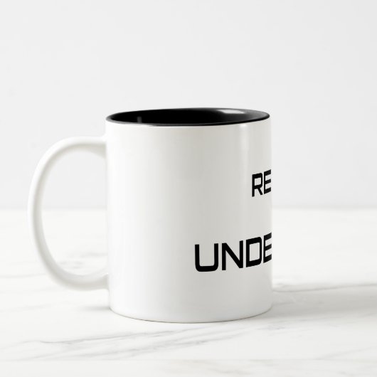Die Realität ist unbesiegt Zweifarbige Tasse (Links)