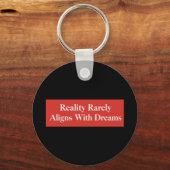 Die Realität passt sich selten den Träumen an Schlüsselanhänger (Rückseite)